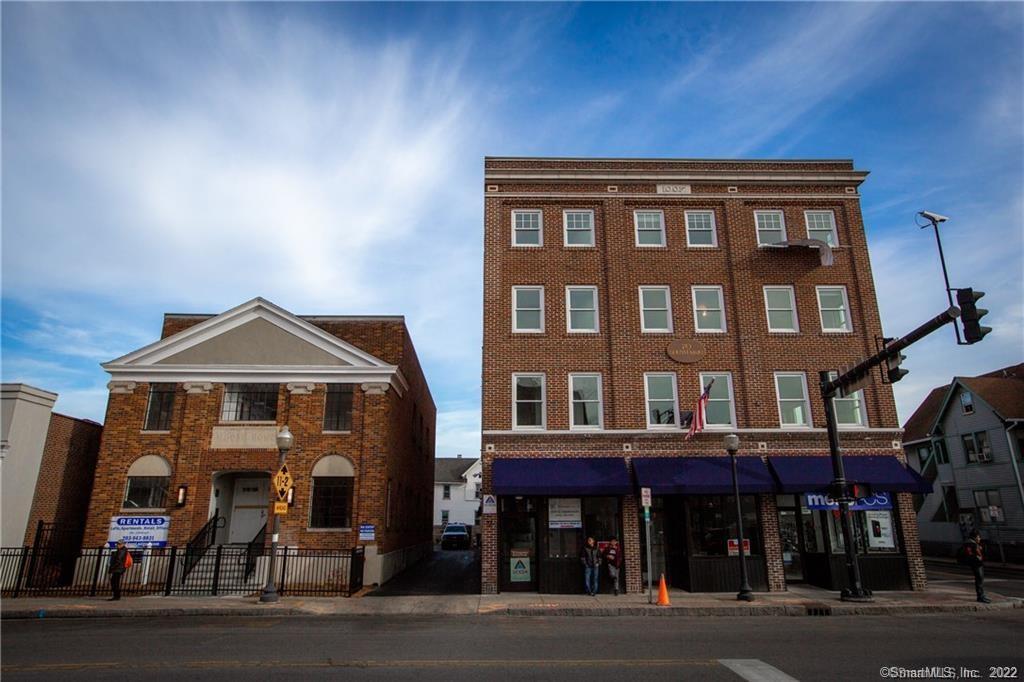 a front view of a building and a parking space