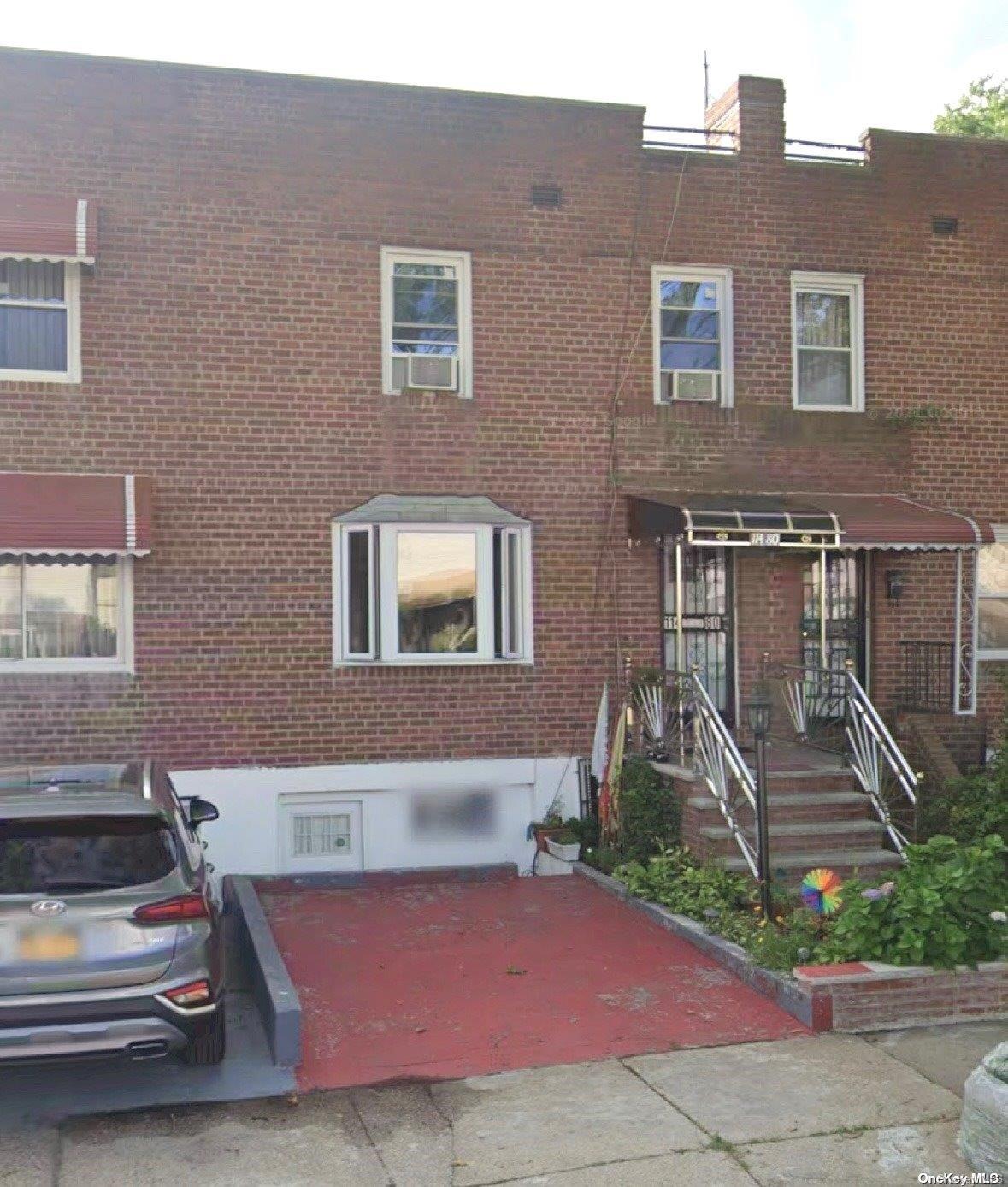 a front view of a house with stairs