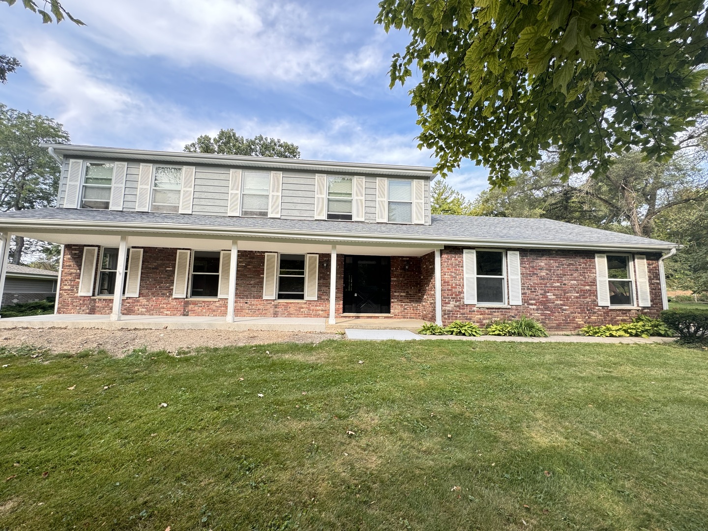 front view of a house with a yard