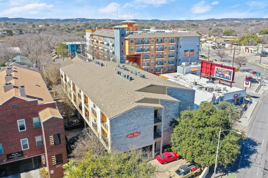 an aerial view of residential houses with outdoor space