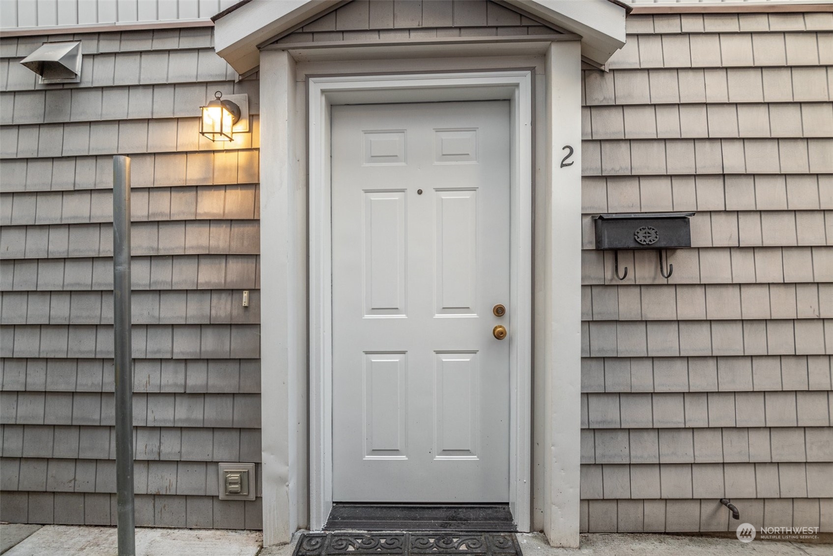 a view of a wooden door and a window