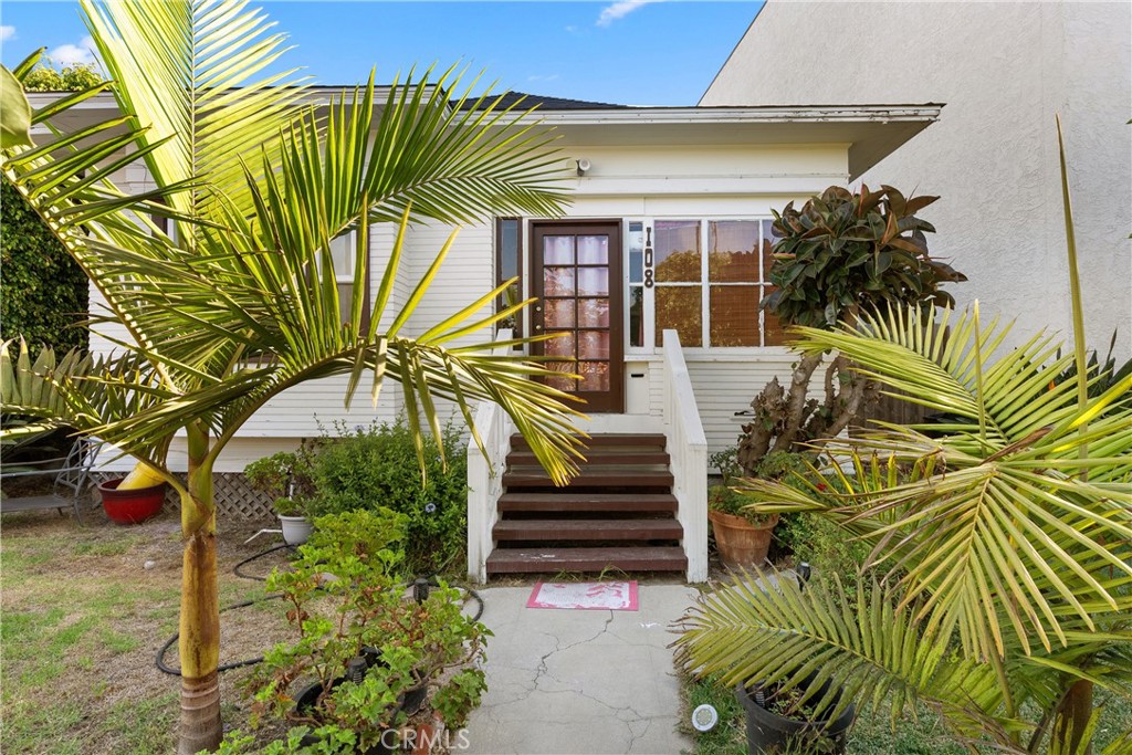 a view of a house with a garden