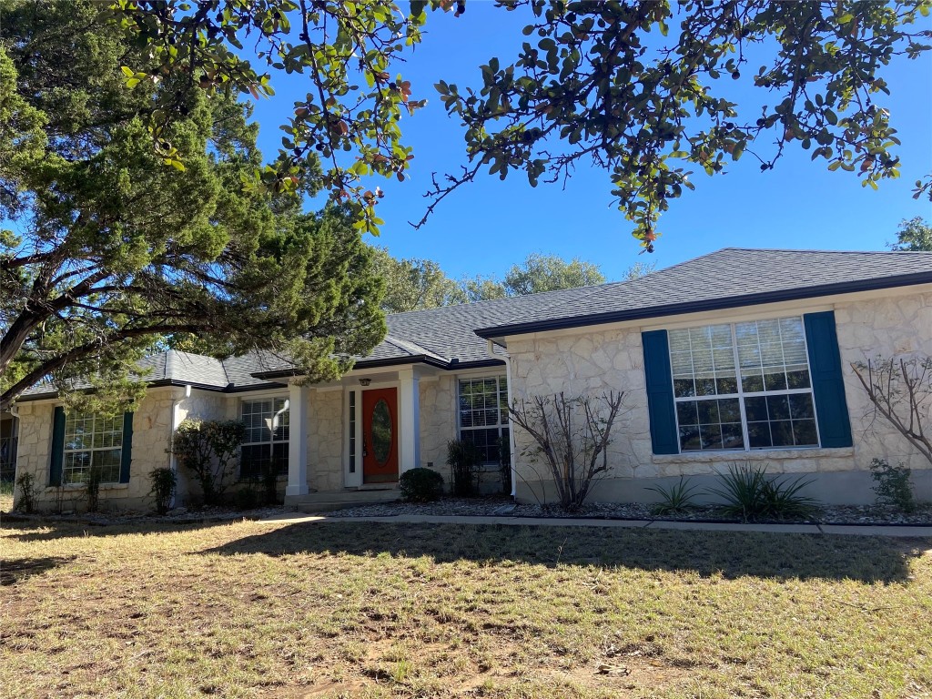 a front view of a house with garden