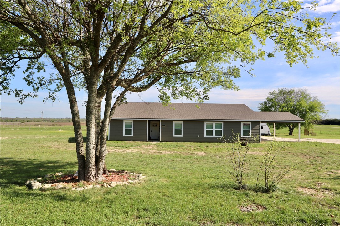 front view of a house with a yard