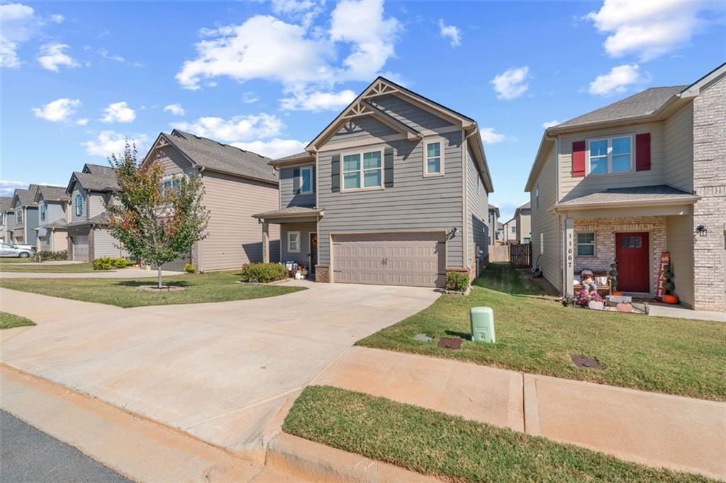 a front view of a house with a yard