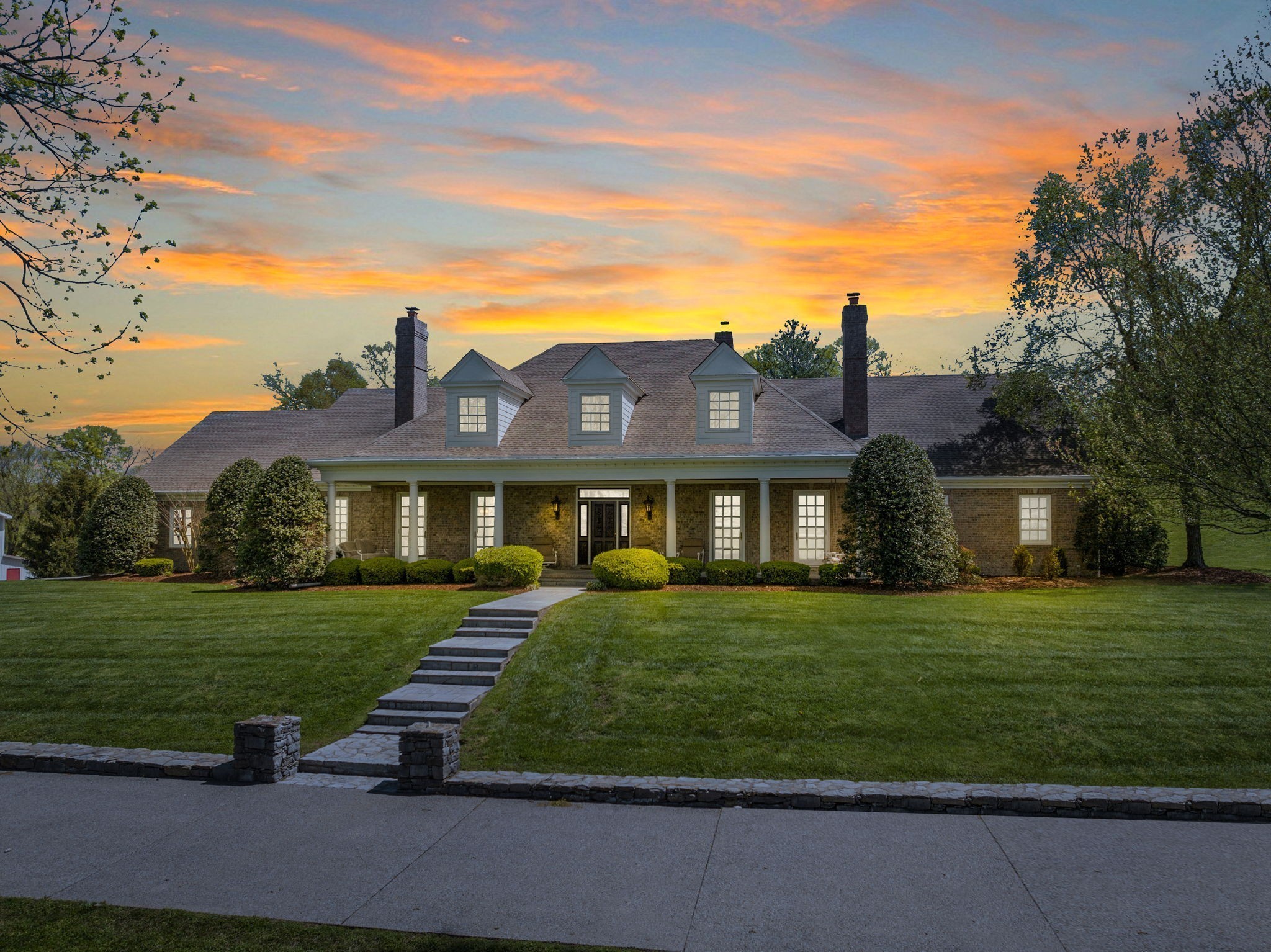 a front view of a house with a yard