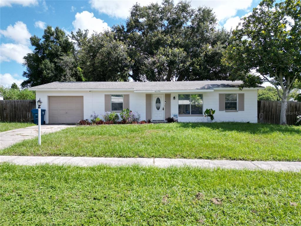 front view of a house and a yard