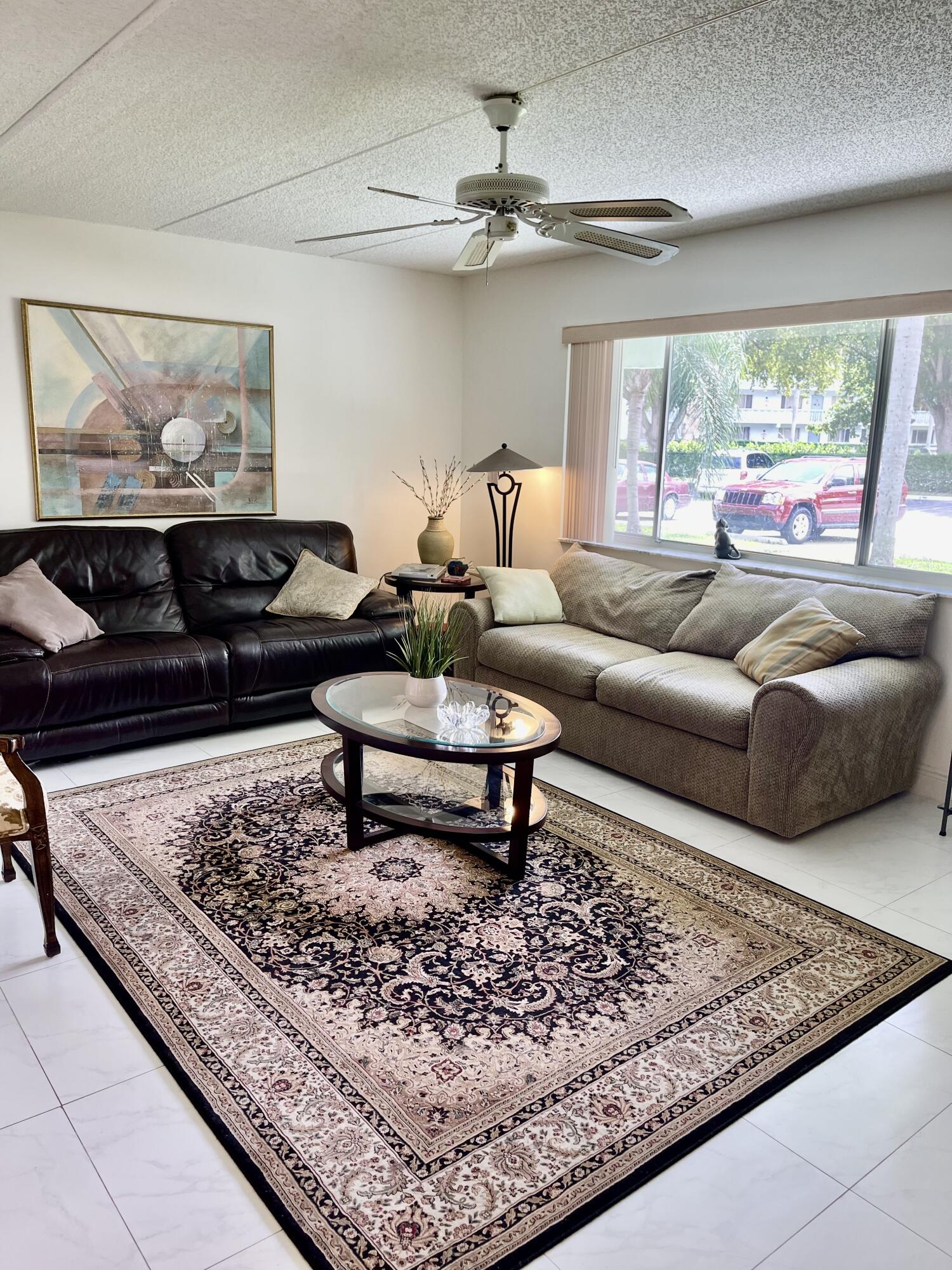 a living room with a couch and a rug