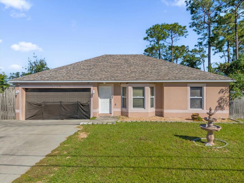 a front view of house with yard outdoor seating and barbeque oven