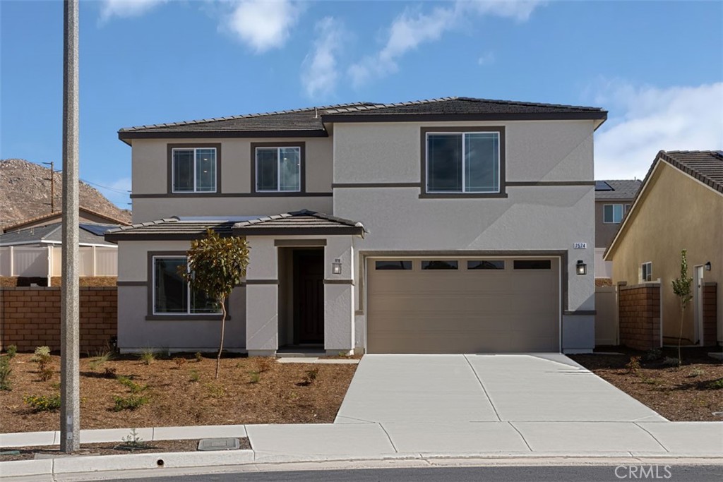 a front view of a house with garage