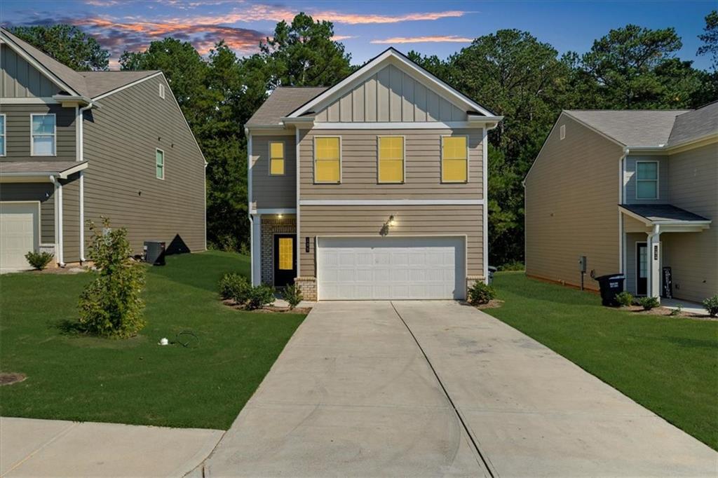 a front view of a house with a yard