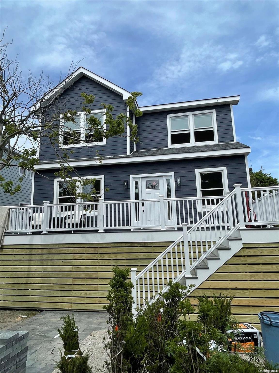 front view of a house with a small yard