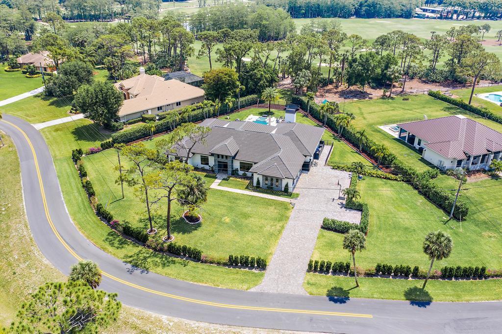 an aerial view of a house with a garden