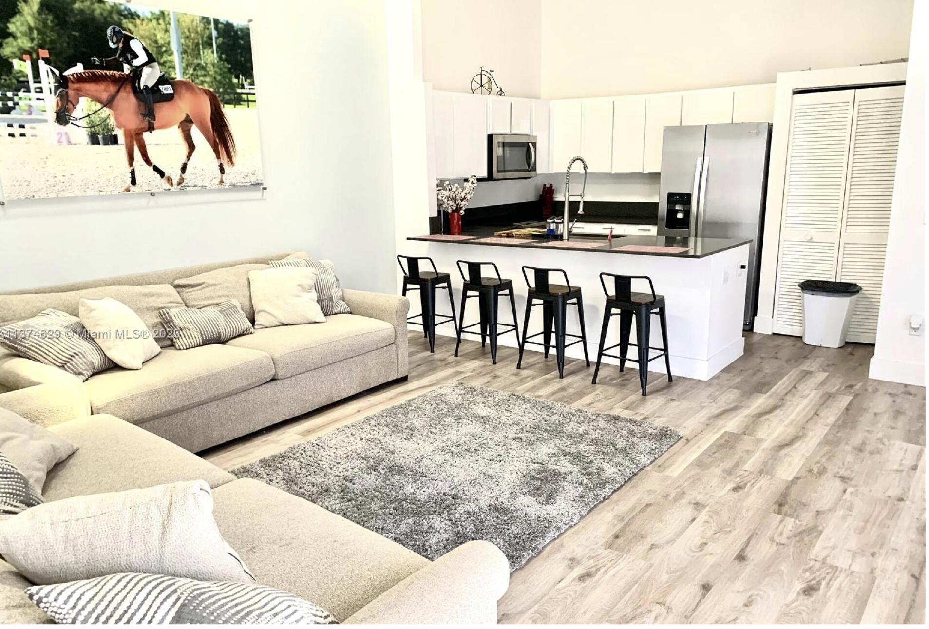 a living room with furniture and a table