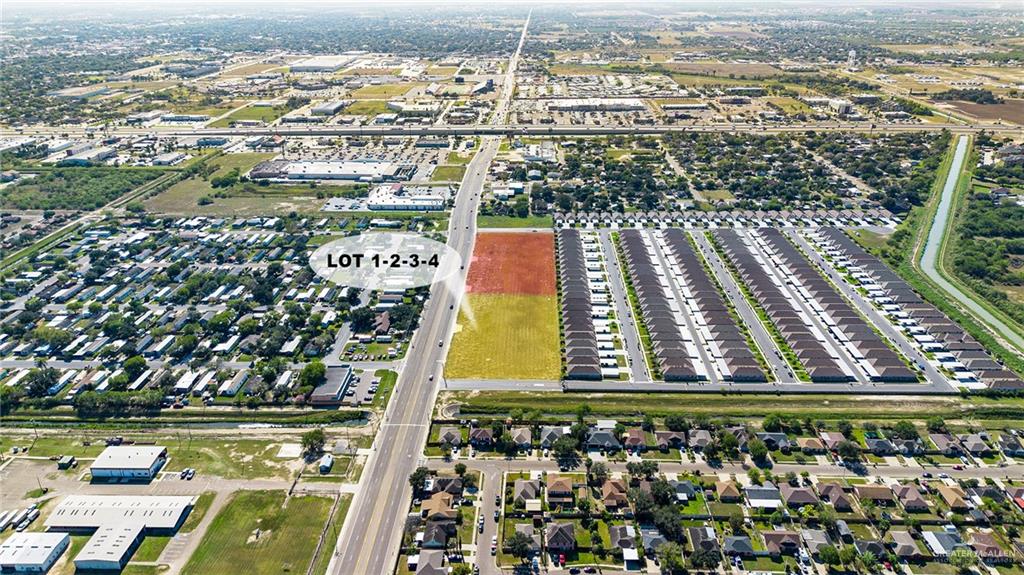 an aerial view of residential houses with yard