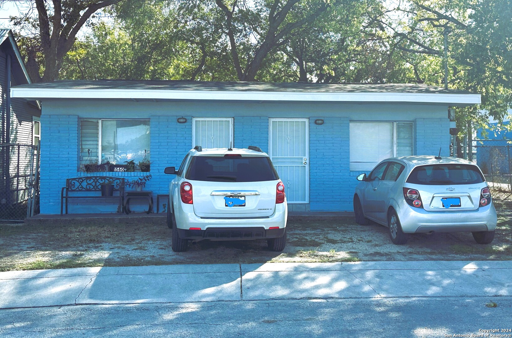 a car parked in front of a house