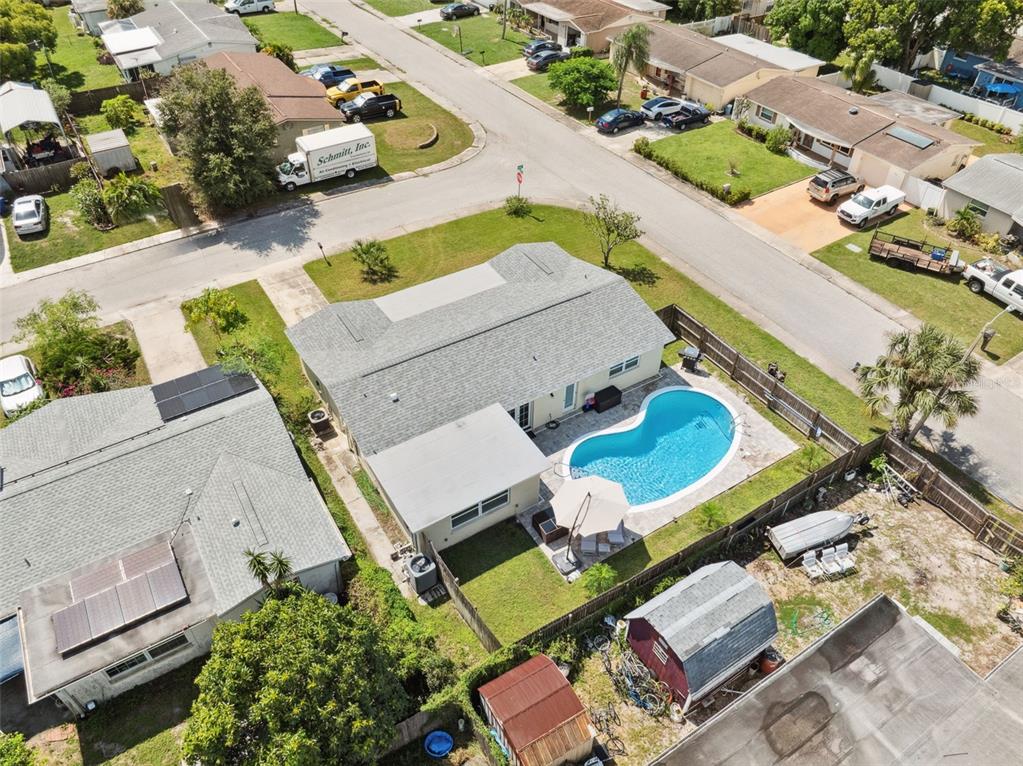 an aerial view of a house with outdoor space