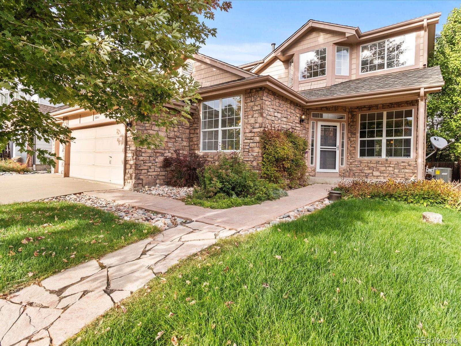 front view of a house with a yard