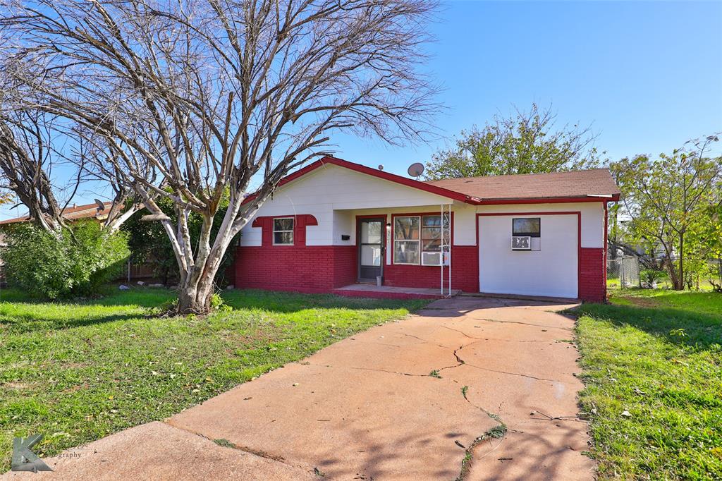 a front view of a house with yard