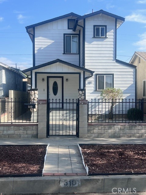 a front view of a house with garage