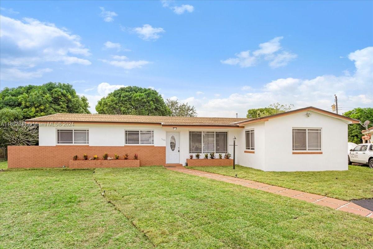 front view of house with a yard