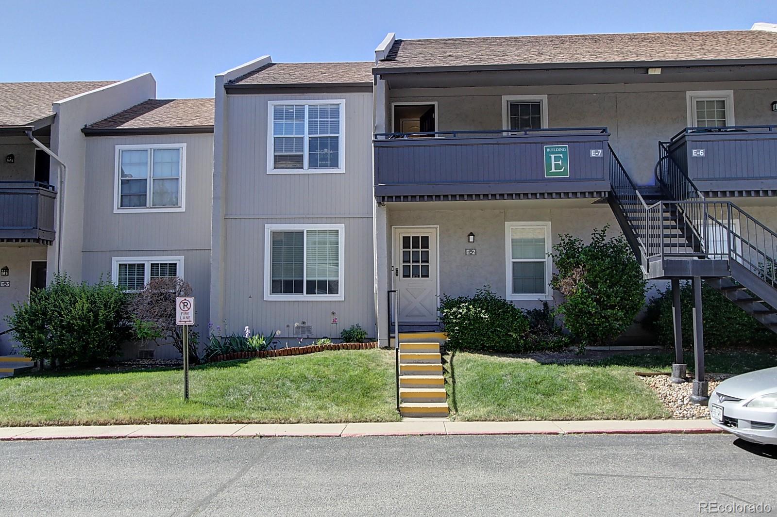 a view of a house with a yard and garage