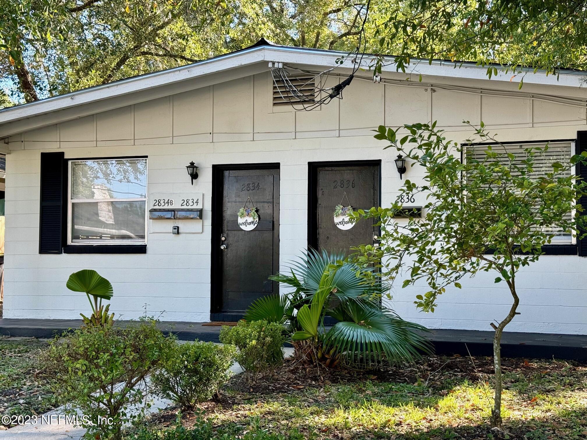 a front view of a house with yard