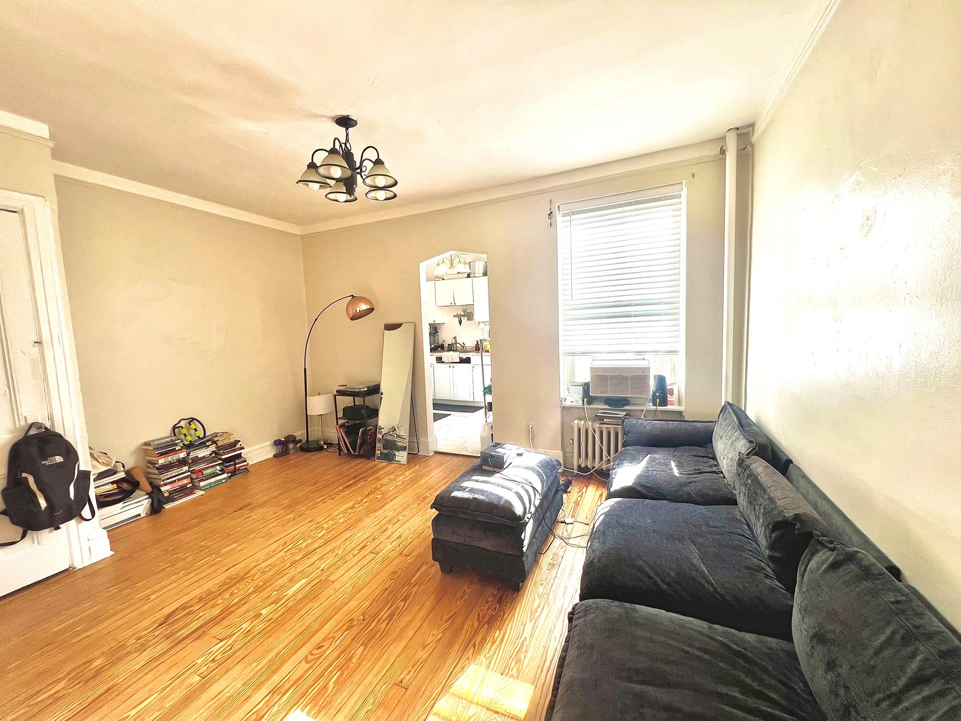 a living room with furniture windows and a flat screen tv