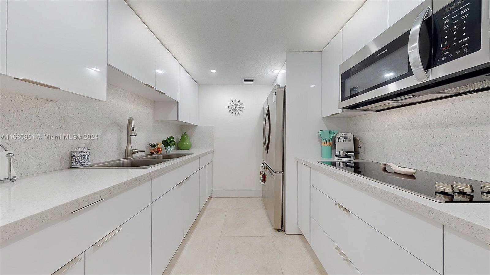 a kitchen with a sink stainless steel appliances and cabinets