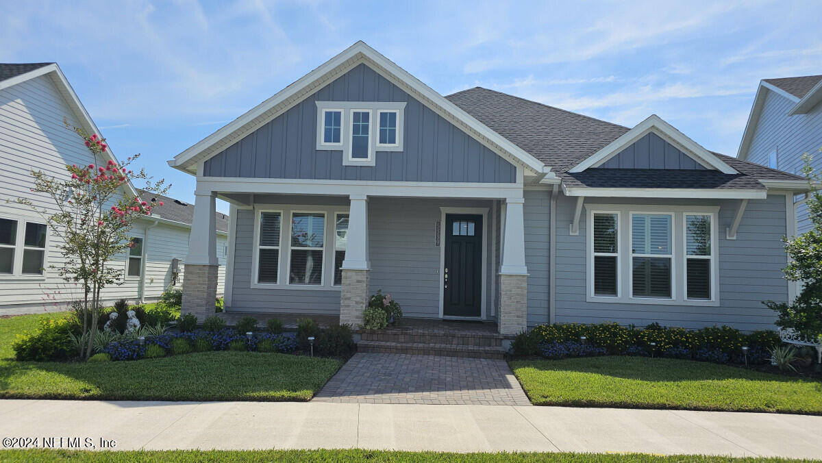 front view of a house with a yard