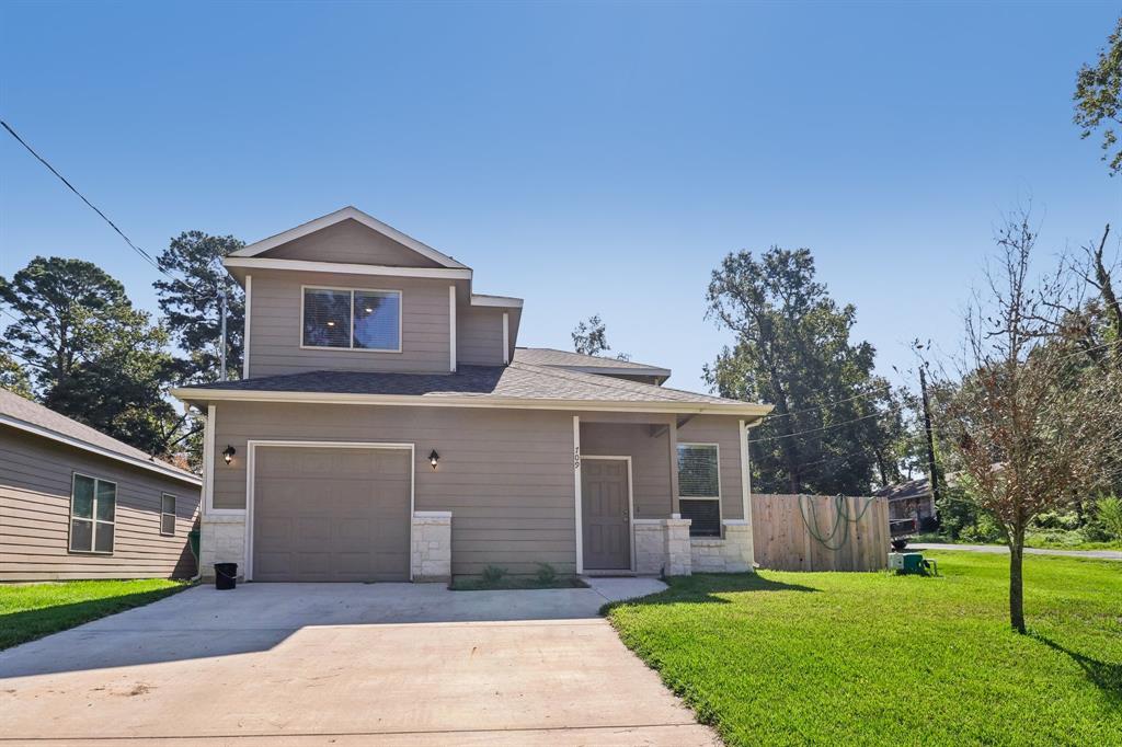 Welcome to your dream home! This modern two-story residence boasts a sleek design with a spacious two-car garage, nestled in a serene neighborhood. The well-manicured lawn adds a touch of greenery, enhancing the home's curb appeal. A perfect blend of comfort and style awaits you.