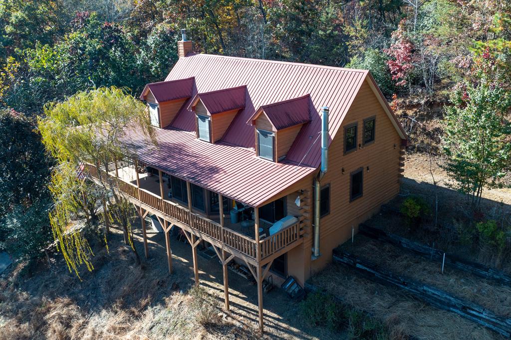 a view of a house with roof deck front of house