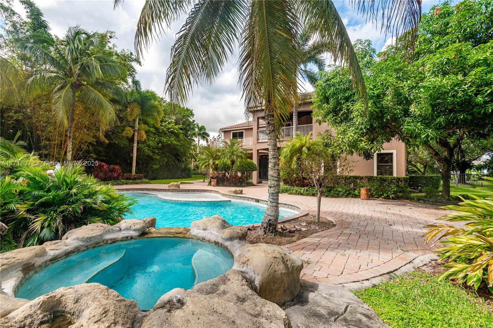 a swimming pool with outdoor seating and yard