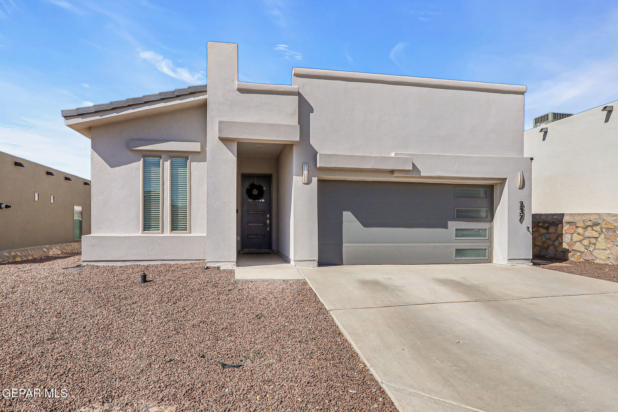 a view of a house with a garage