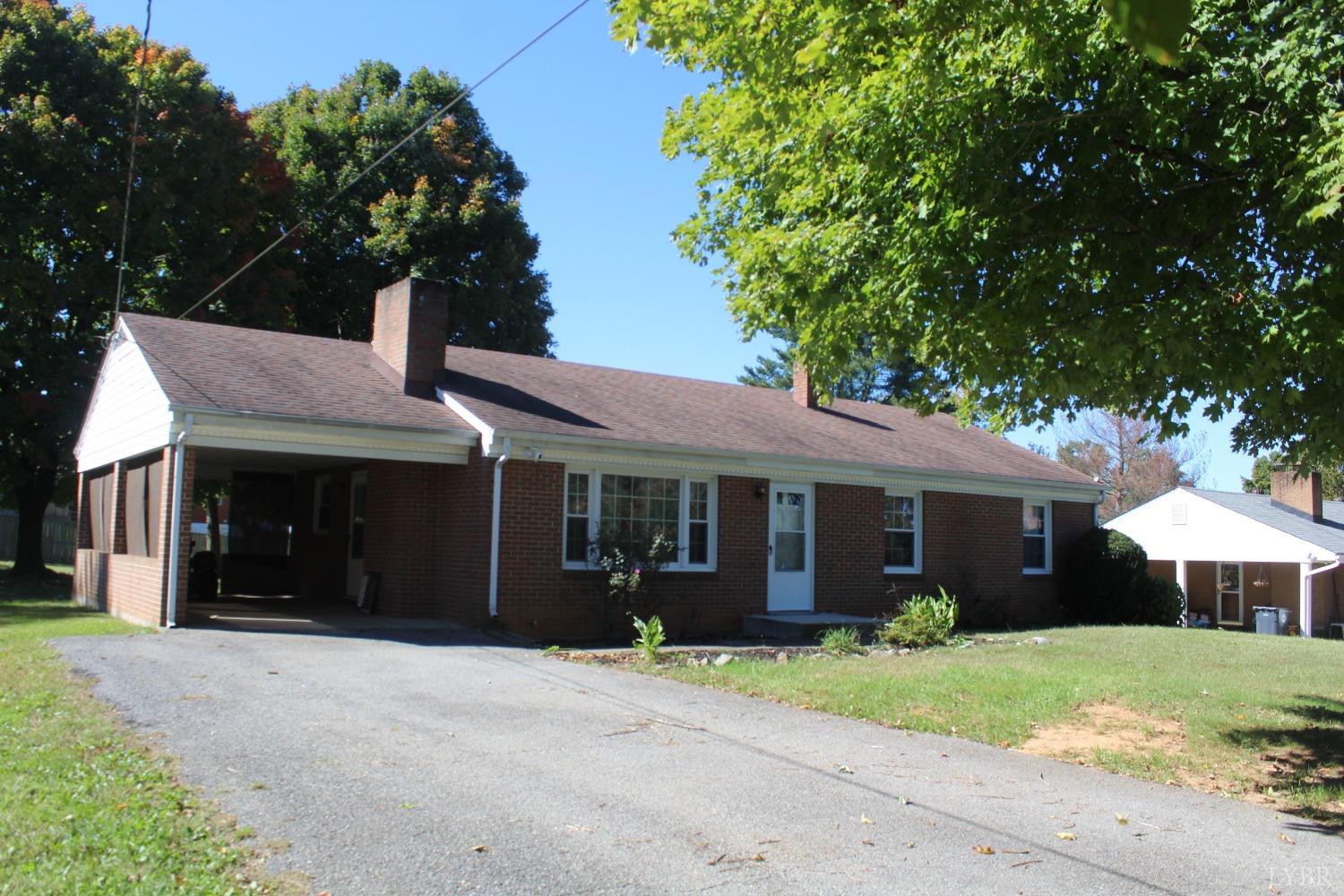 a front view of a house with a garden and porch