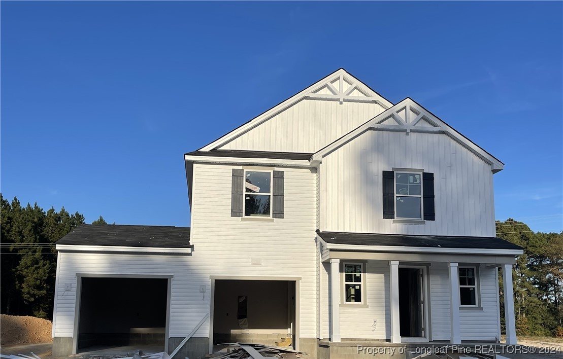 a front view of a house with a garage