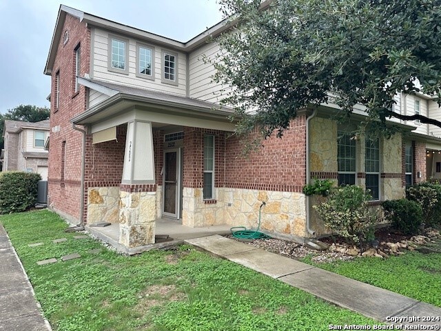 a front view of a house with a yard