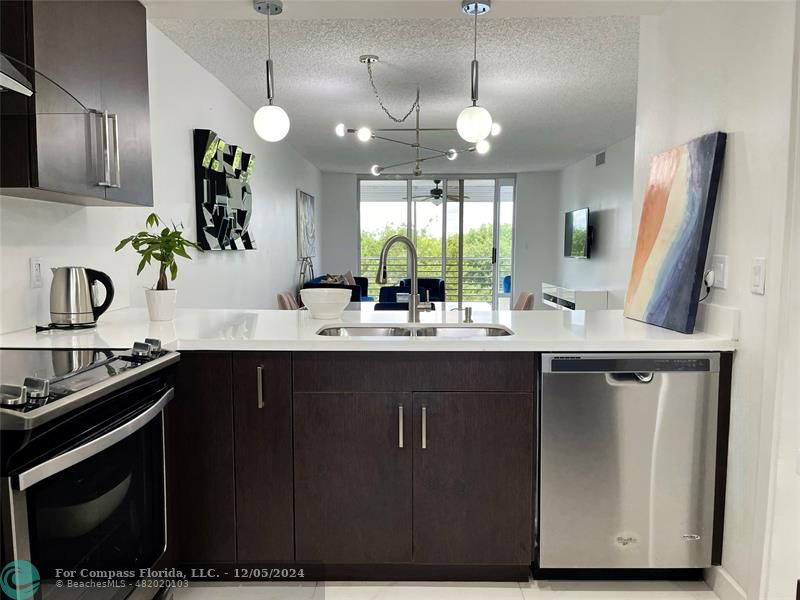 a kitchen with a sink and a stove