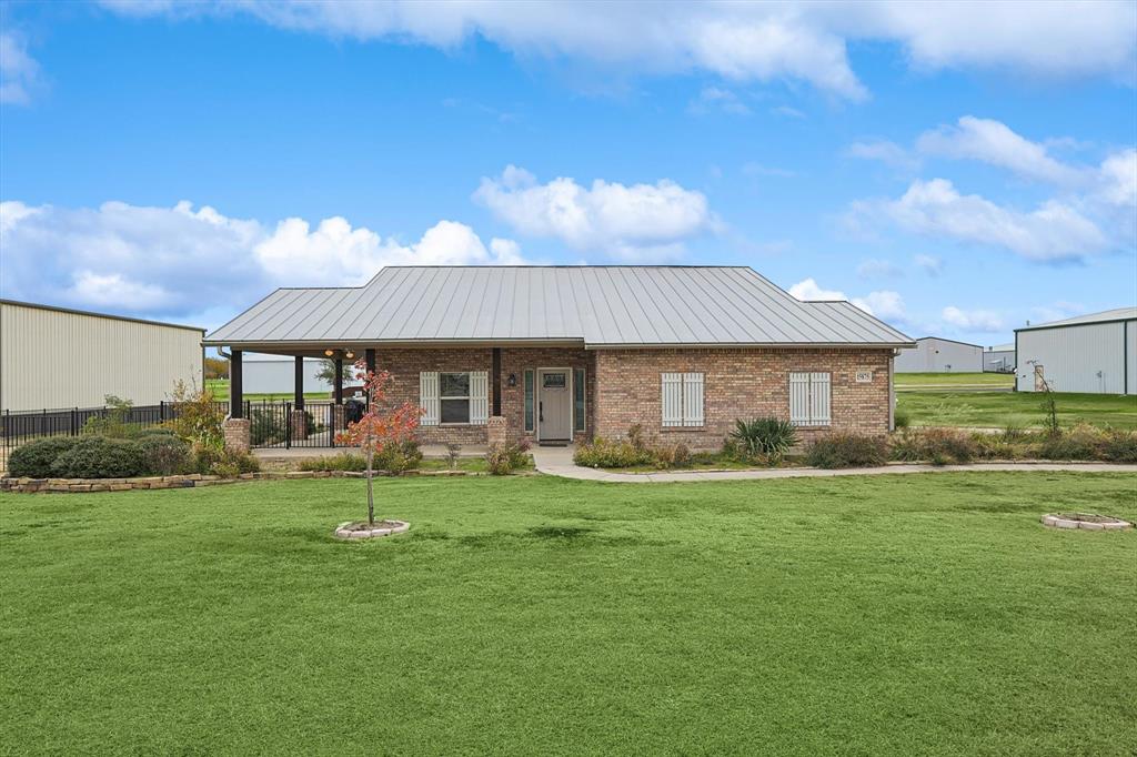 a front view of a house with garden and porch