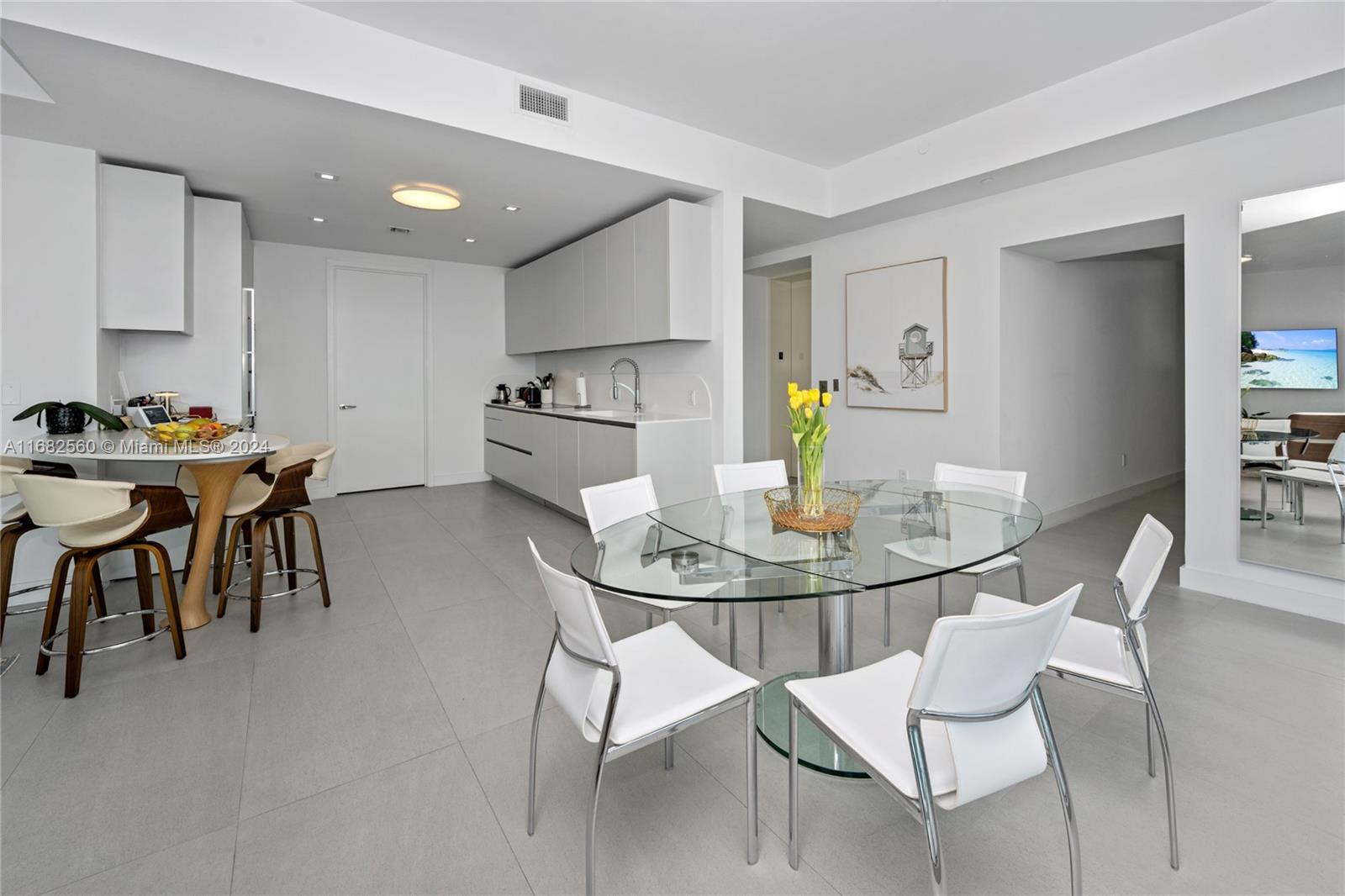 a view of a dining room with furniture and a table