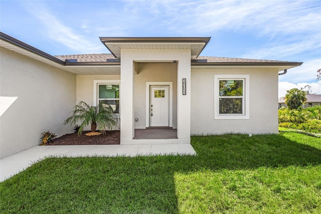 front view of a house with a yard