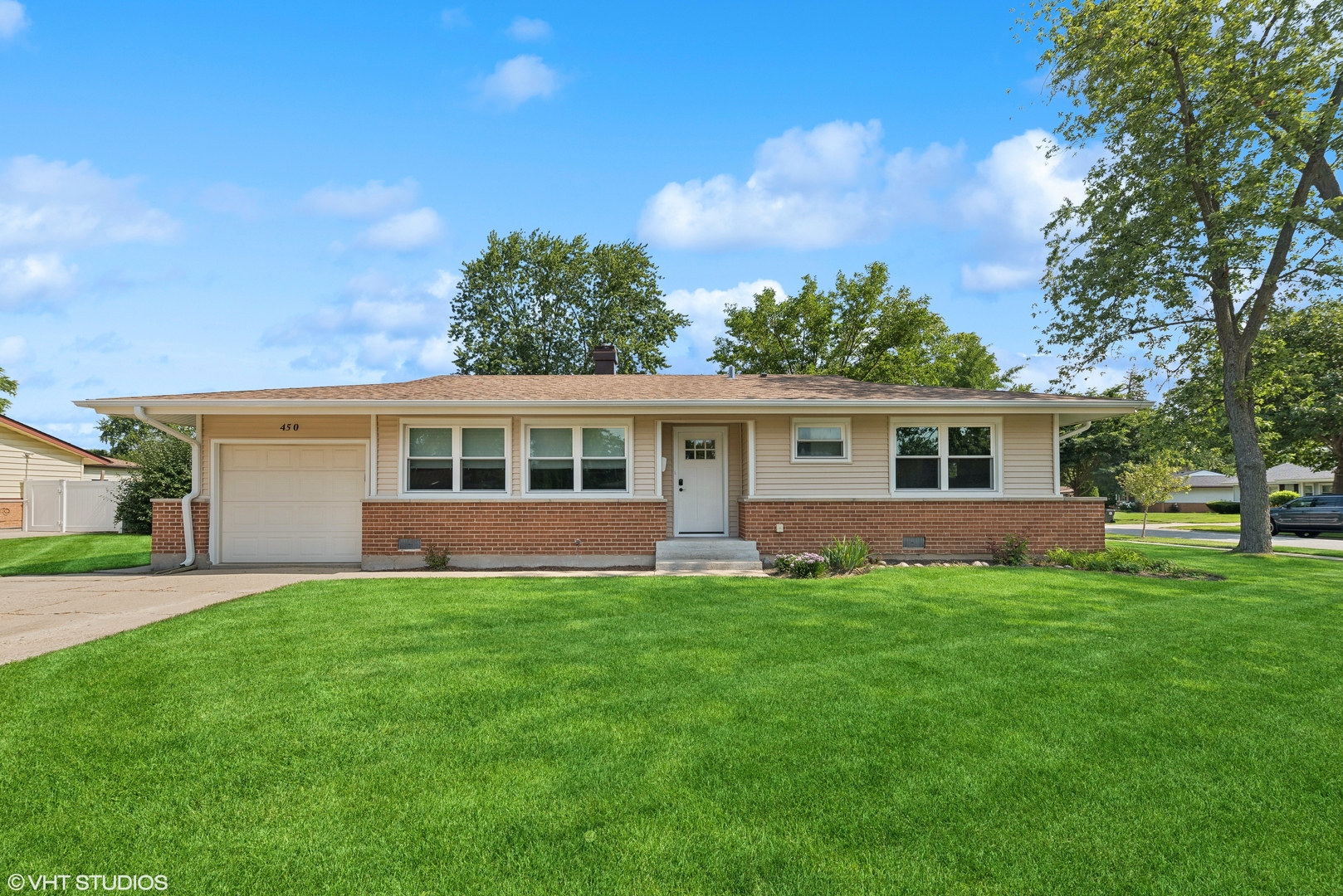 front view of a house with a yard