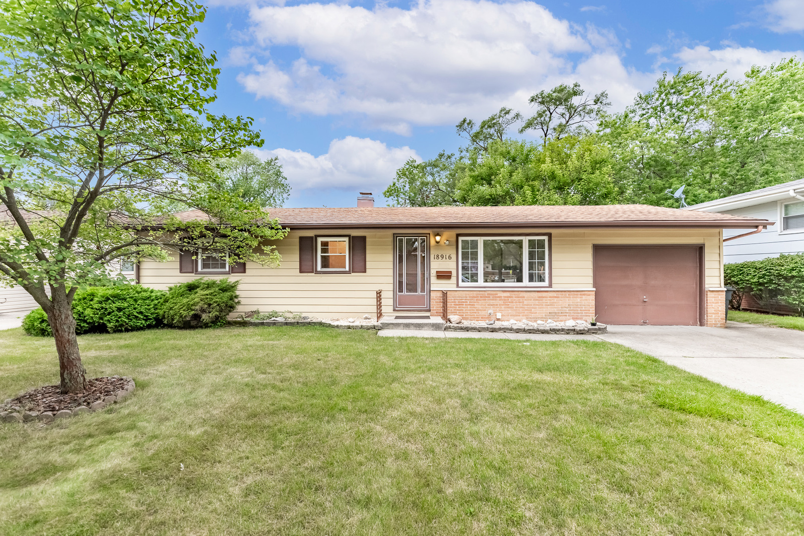 front view of a house with a yard