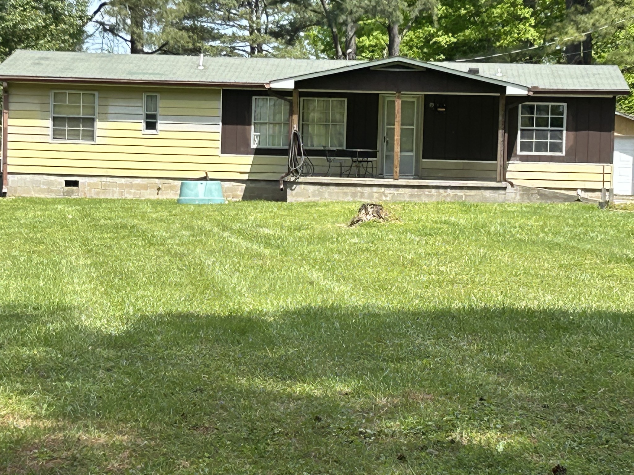 a house that has a big yard in front of it