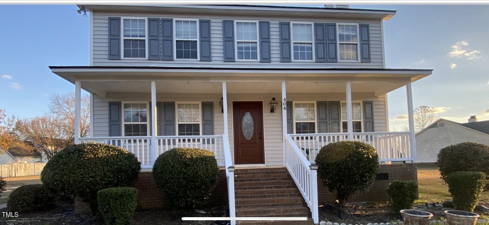 a front view of a house with many windows