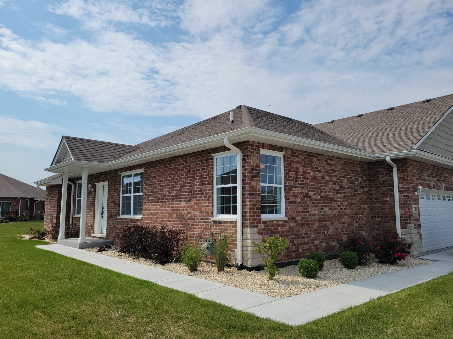 front view of a house with a yard