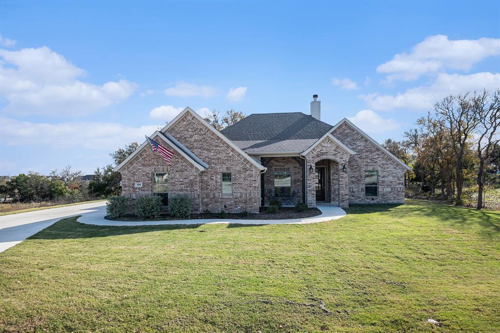 a front view of a house with a yard