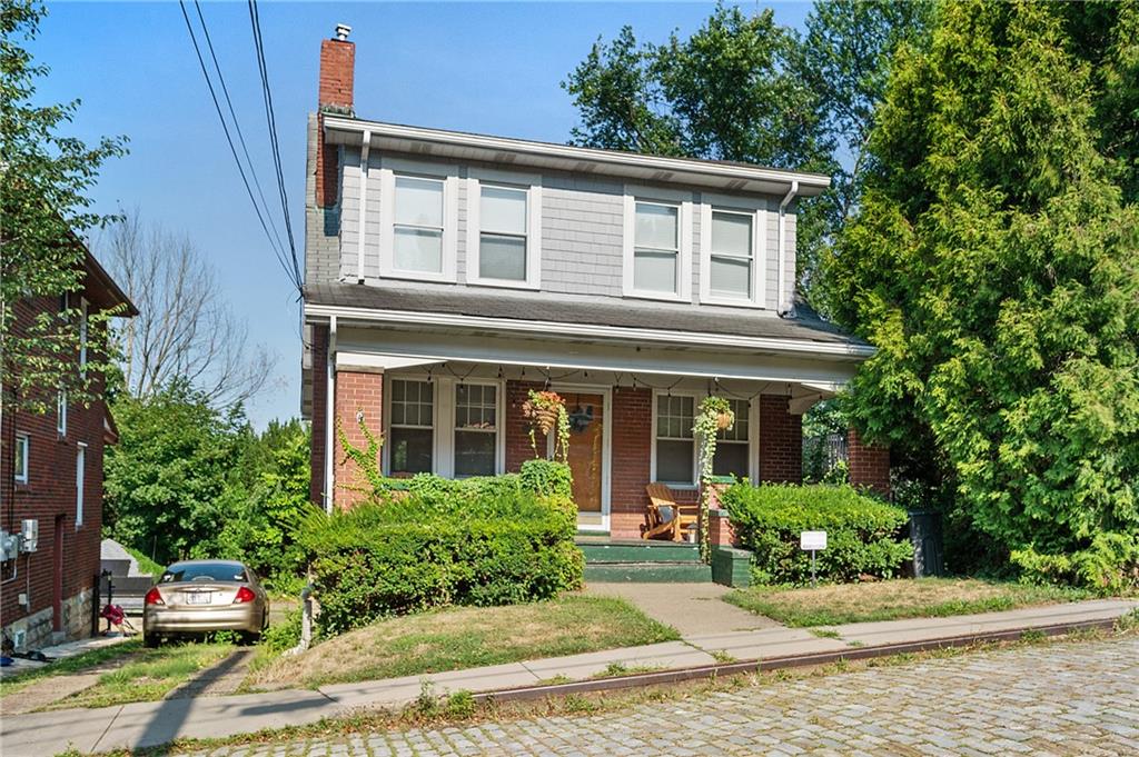 front view of a house with a yard