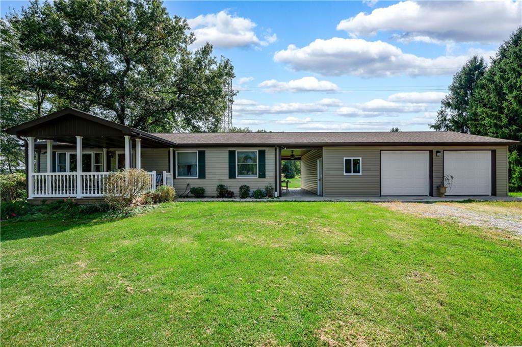 a view of a house with a backyard