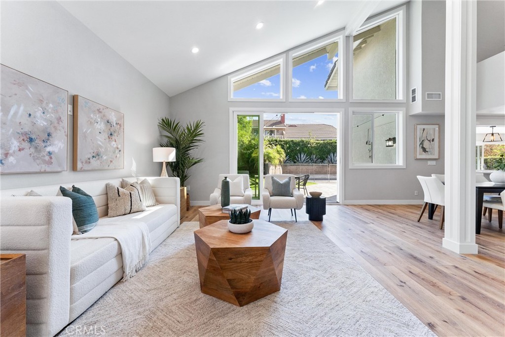 a living room with furniture or couch and a large window